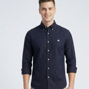 Men wearing a navy blue slim fit casual shirt with button-down collar and full sleeves paired with beige chinos